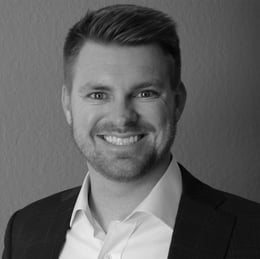 Headshot-Reid-Stack-Black-White-e1735322986235